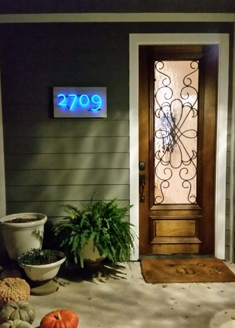 Neon house number welcome gusts to the front door