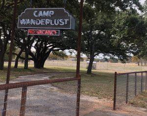 Camp Wanderlust neon sign in Hye, TX