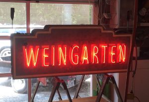 Building Weingarten neon sign in Fredericksburg Texas