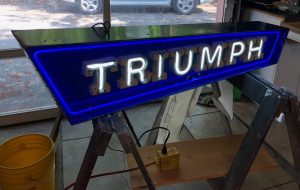 Completed restoration of a British Triump neon sign